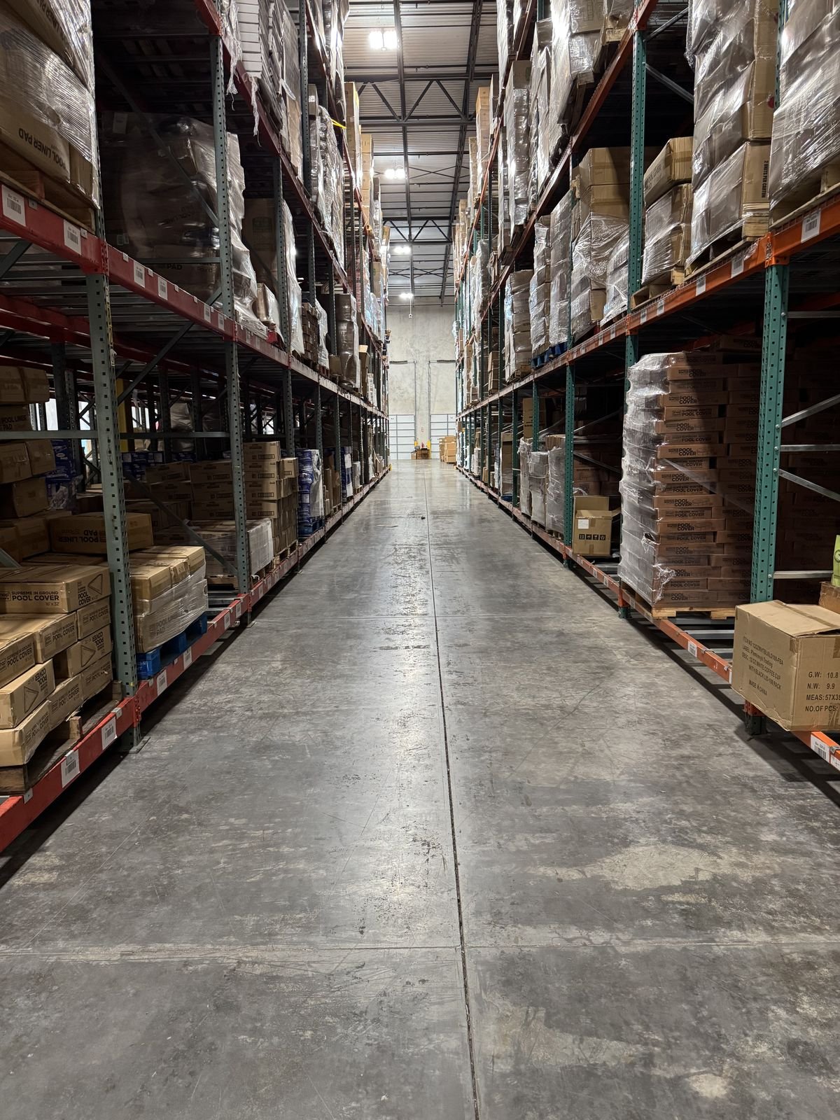 Warehouse aisle with organized inventory on shelves